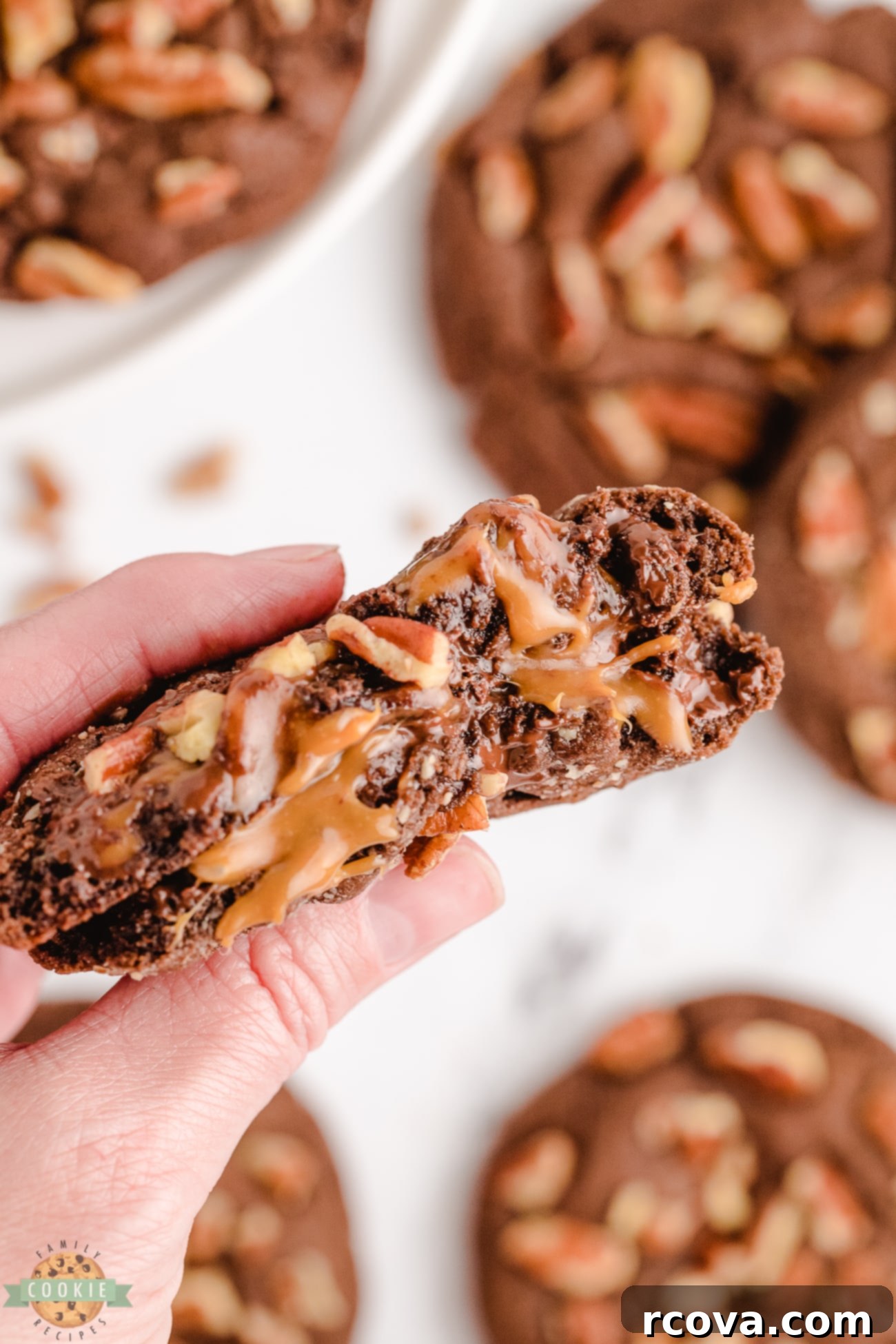 Gooey Caramel Pecan Chocolate Cookies 6 chocolate turtle cookies broken in half with caramel
