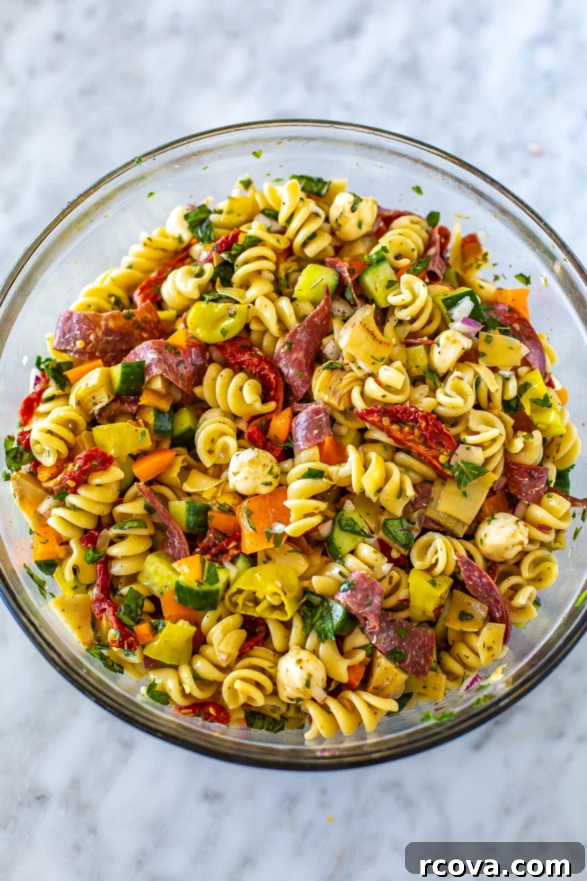 Over 25 Delicious No-Cook Recipes for Summer 13 A big bowl filled with Italian pasta salad.