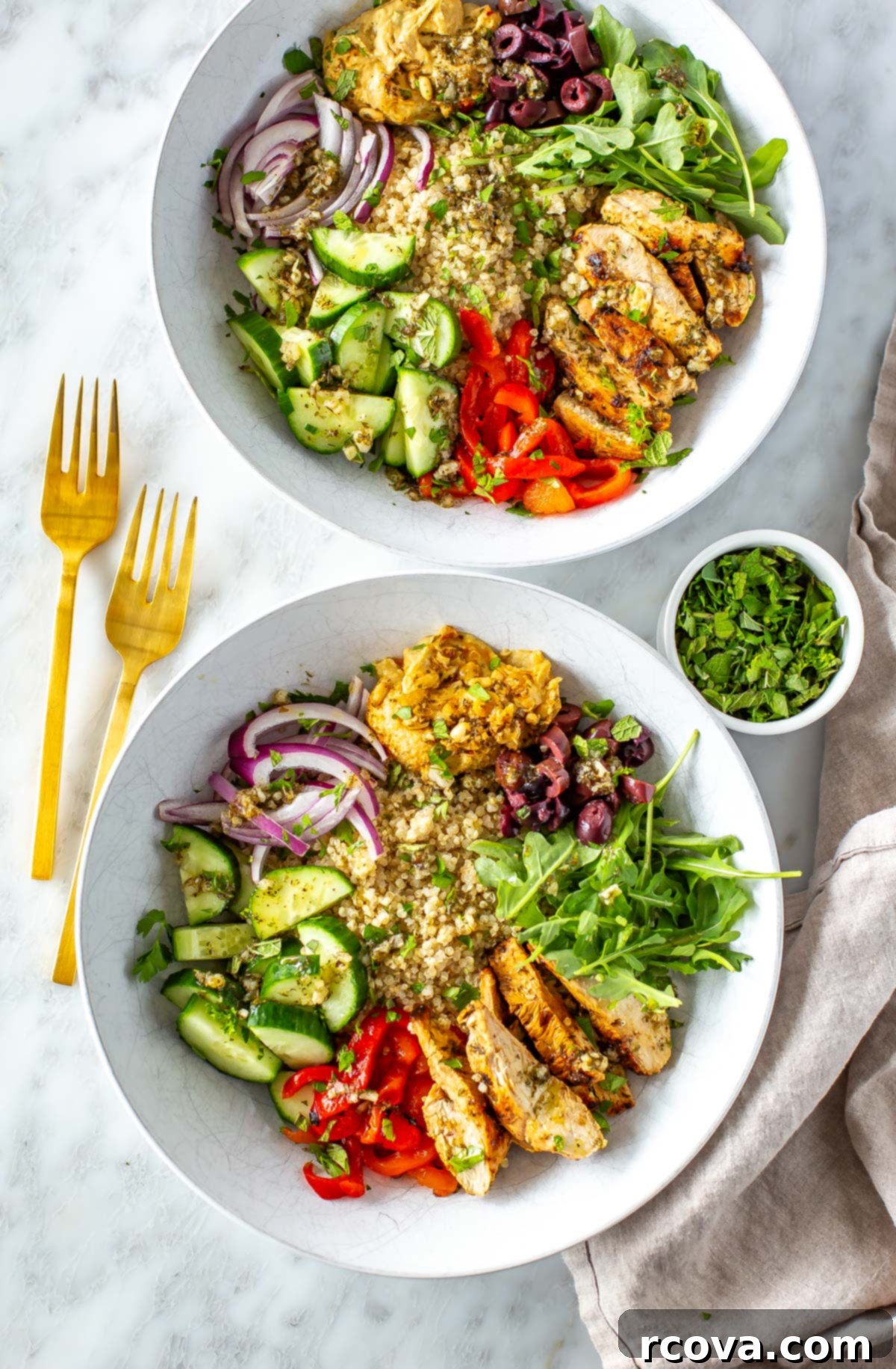 Over 25 Delicious No-Cook Recipes for Summer 24 Two Mediterranean bowls topped with parsley.