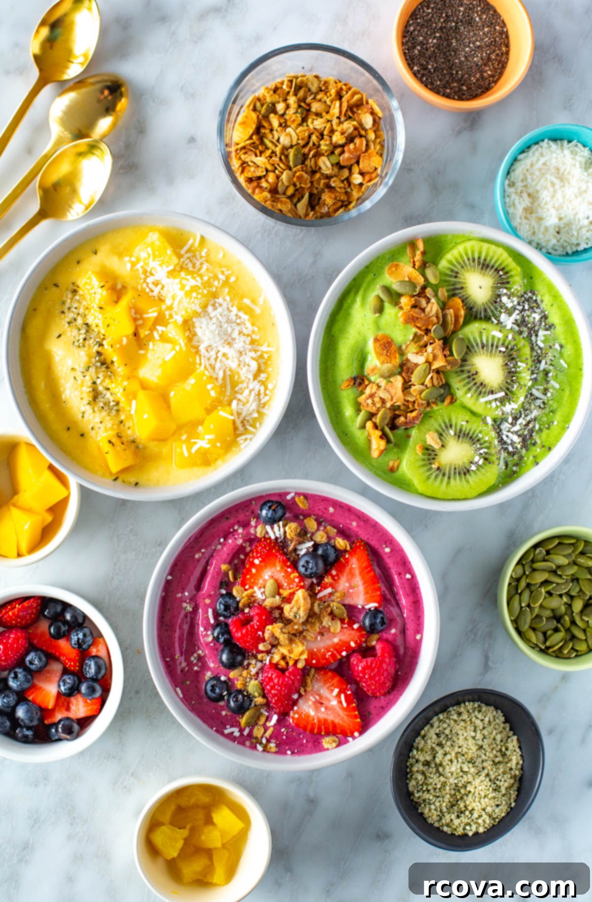 Over 25 Delicious No-Cook Recipes for Summer 6 Three smoothie bowls with a variety of toppings.