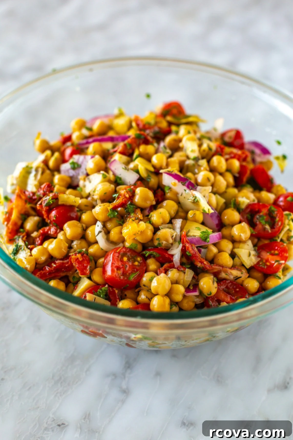 Over 25 Delicious No-Cook Recipes for Summer 8 A big bowl of Mediterranean chickpea salad.