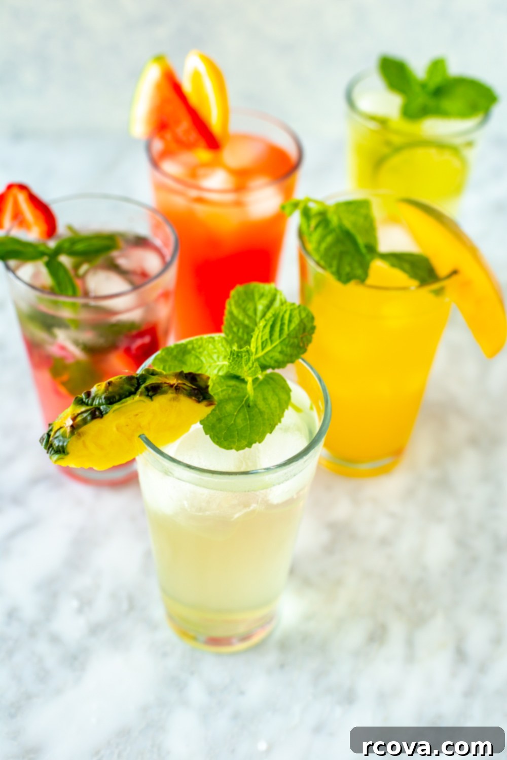 Summer's Coolest Sips 2 A vibrant assortment of refreshing summer drinks, garnished with fresh fruits and herbs, perfect for a hot day.