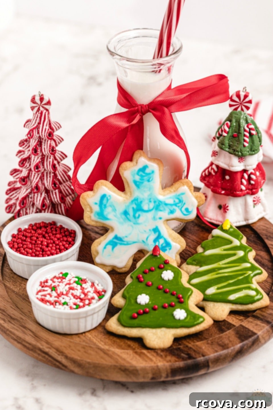 Crafting Christmas Cookie Magic 5 How to make Christmas Cut Out Cookies. A plate of baked and iced Christmas star and tree shaped cookies with colorful sprinkles.
