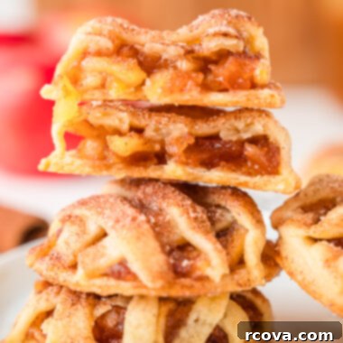 Spiced Apple Pie Delights 5 A charming stack of freshly baked spiced apple pie cookies, topped with a delicate lattice, ready to be enjoyed.