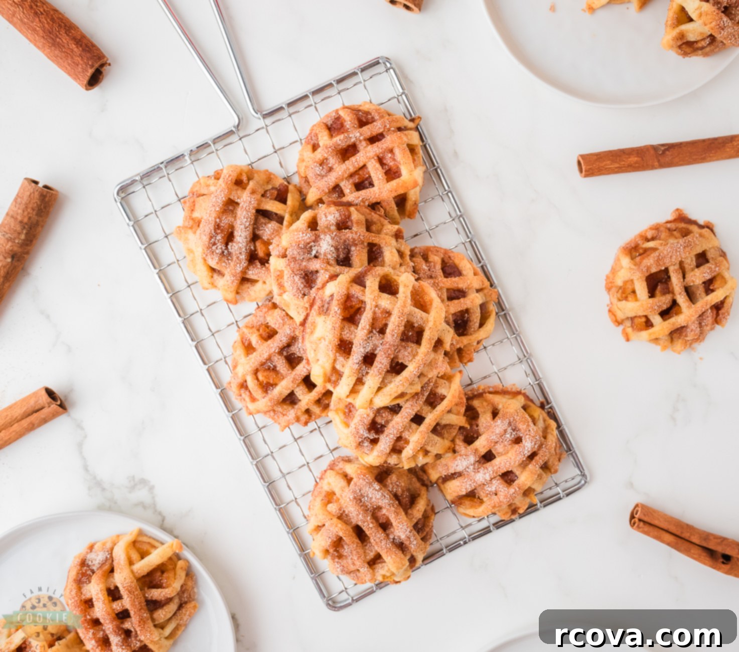Spiced Apple Pie Delights 6 Freshly baked spiced apple pie cookies cooling on a wire rack, steam gently rising, showcasing their perfect golden crusts.