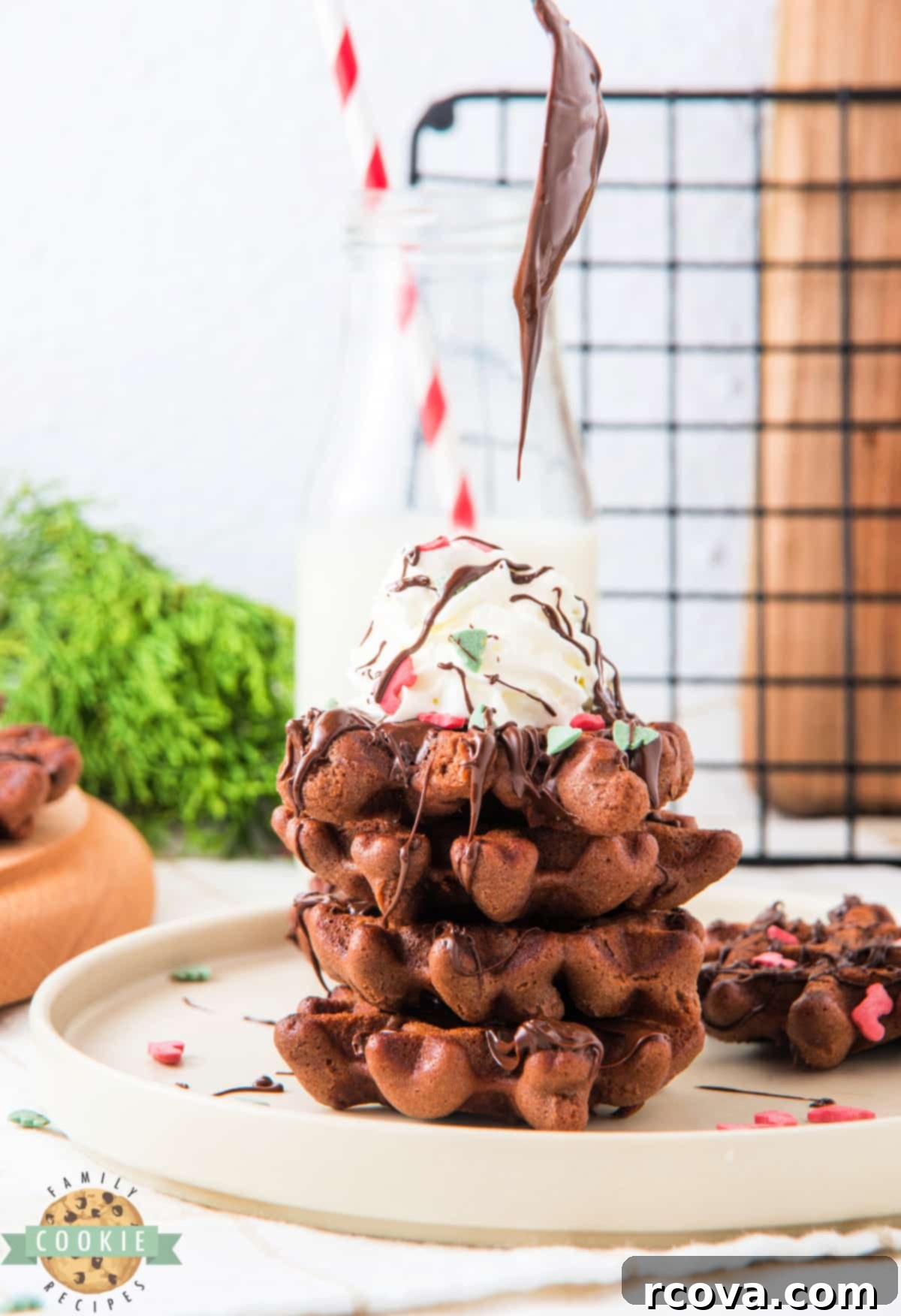 Yuletide Chocolate Waffle Treasures 5 Stack of chocolate waffle cookies with whipped cream on top.