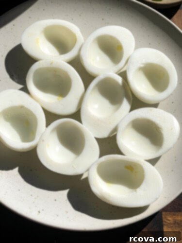 Fiery Sriracha Bacon Deviled Eggs 4 sliced eggs, yolks removed to prepare deviled eggs
