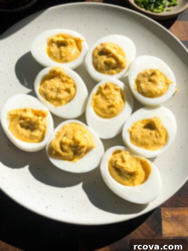 Fiery Sriracha Bacon Deviled Eggs 8 egg yolk mixture spooned into egg halves