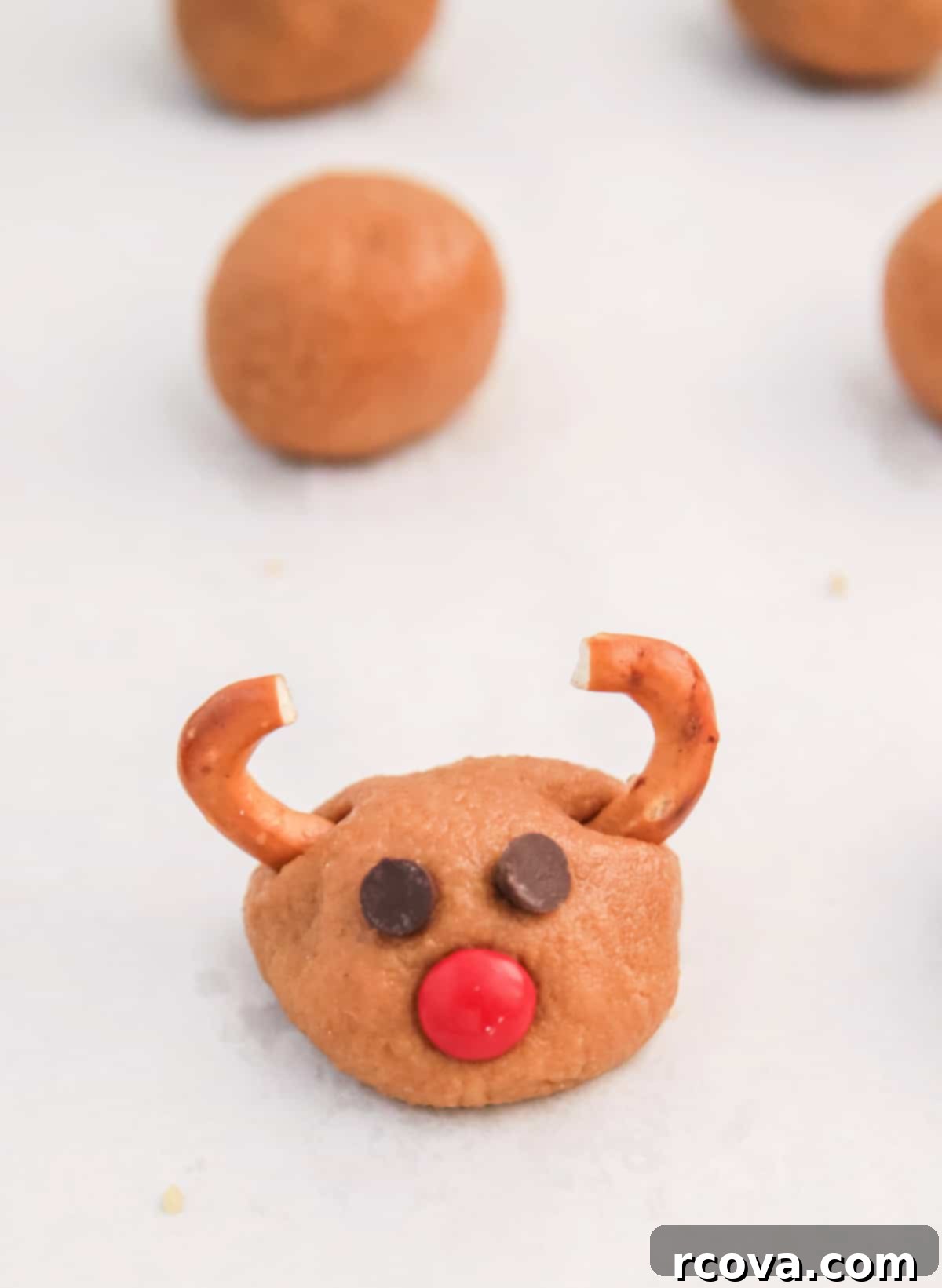 Rudolph's Cookie Butter Truffles 8 Add eyes, nose, and antlers to cookie balls.