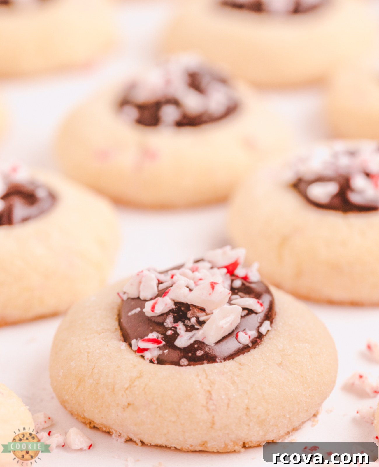 Peppermint Kissed Chocolate Thumbprints 2 peppermint chocolate thumbprints on a holiday platter