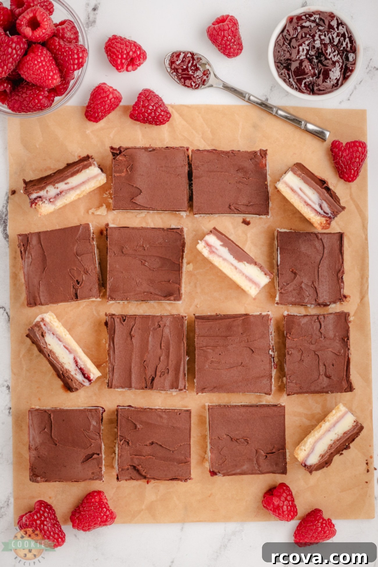 Gourmet Raspberry Chocolate Bars 7 A large tray filled with perfectly cut chocolate raspberry cookie bars, ready for serving.