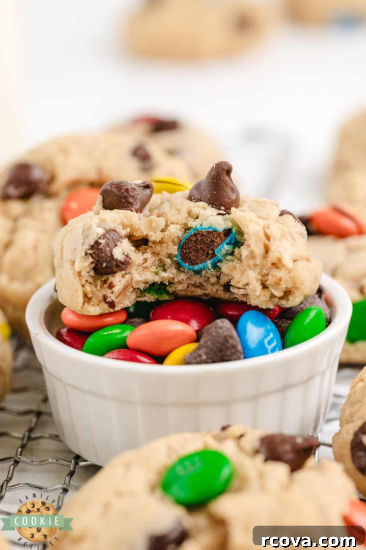 Easy 5-Ingredient Monster Cookies 5 A batch of freshly baked easy Monster Cookies on a cooling rack.