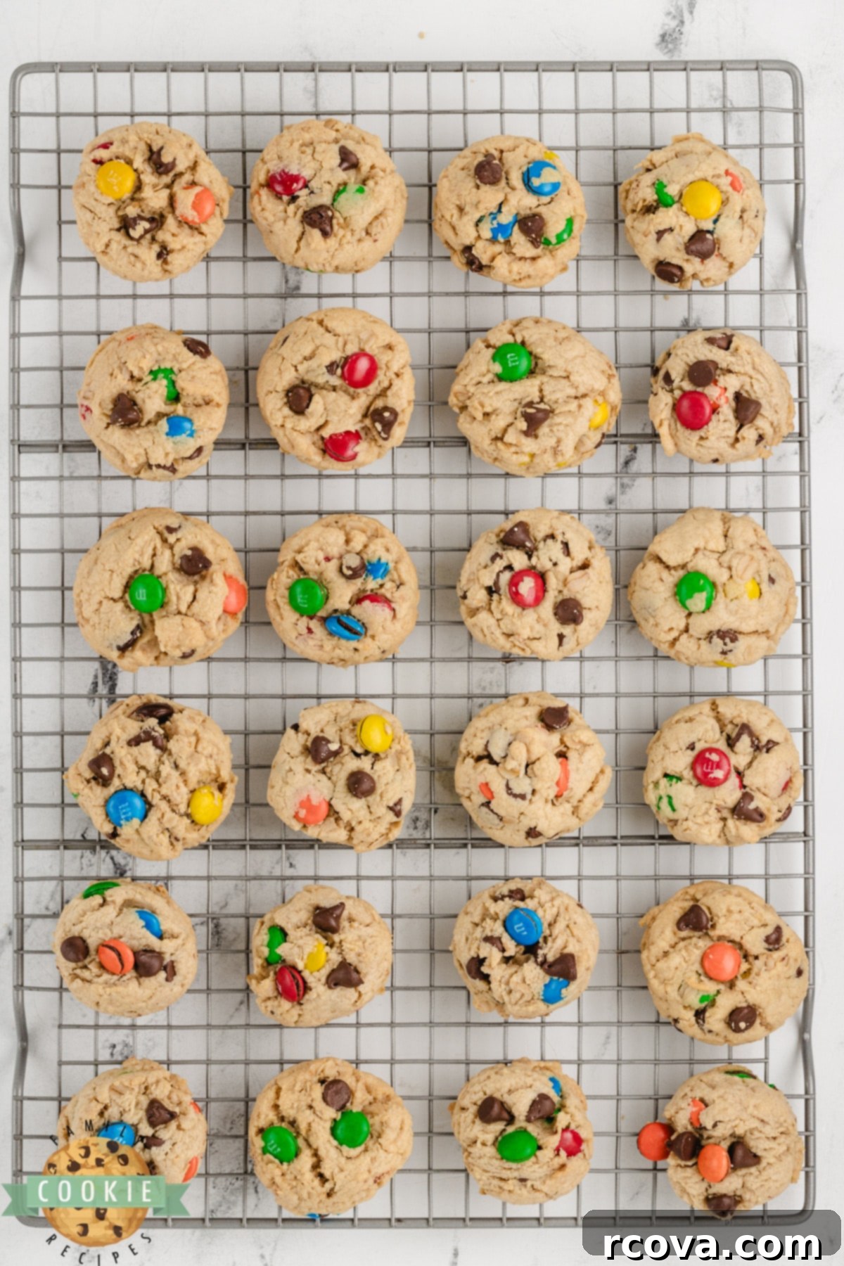 Easy 5-Ingredient Monster Cookies 9 Warm 5-Ingredient Monster Cookies cooling on a wire rack after baking.