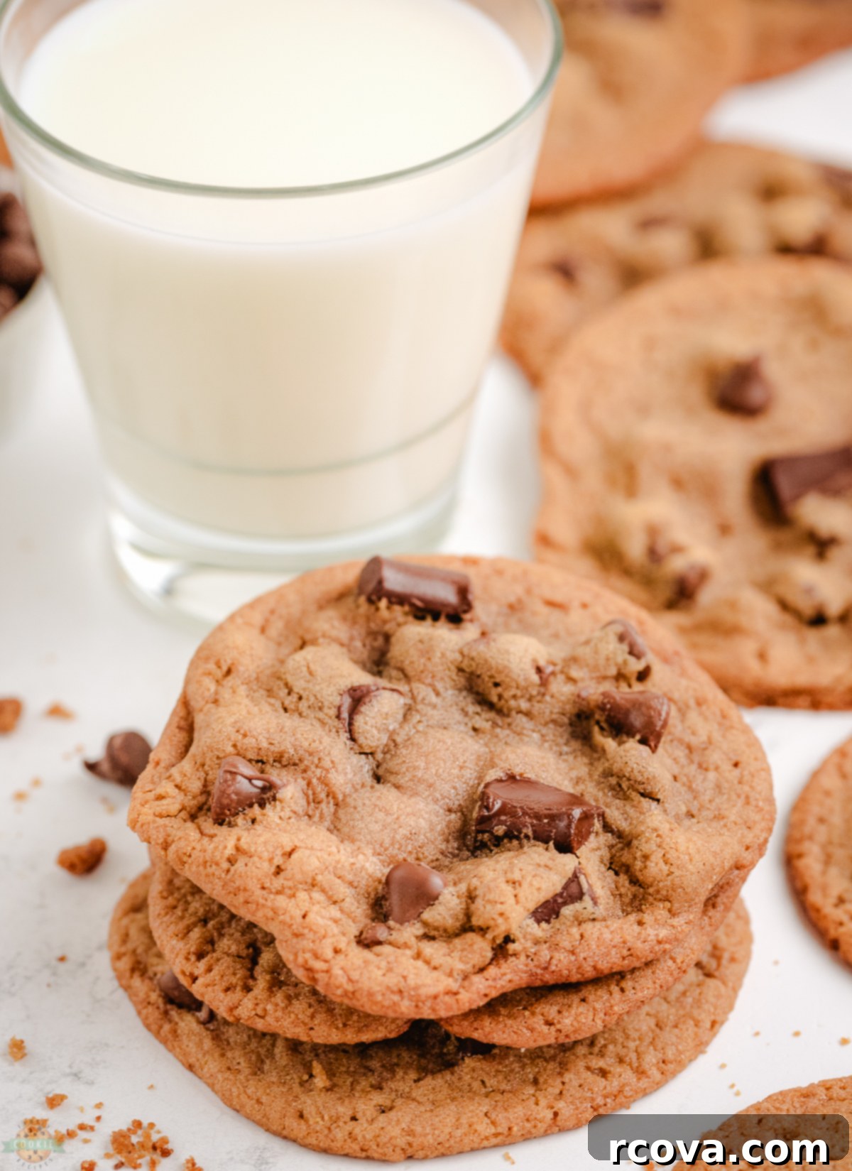 Signature Malted Chocolate Chip Cookies 5 Stack of malt chocolate chip cookies next to a cold glass of milk, a perfect snack
