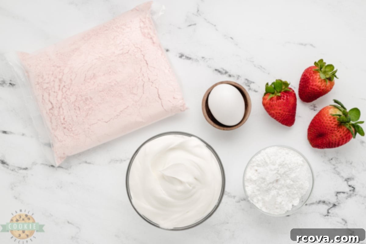 Whipped Strawberry Cloud Cookies 4 All the essential ingredients for making Strawberry Cool Whip Cookies neatly laid out: a box of strawberry cake mix, a container of Cool Whip, a single egg, and powdered sugar for rolling.