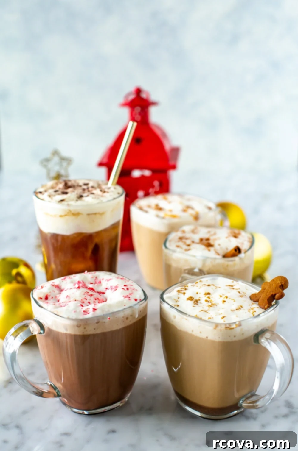Recreate Every Starbucks Holiday Drink from Your Kitchen 9 Starbucks holiday drinks in mugs on a wooden surface