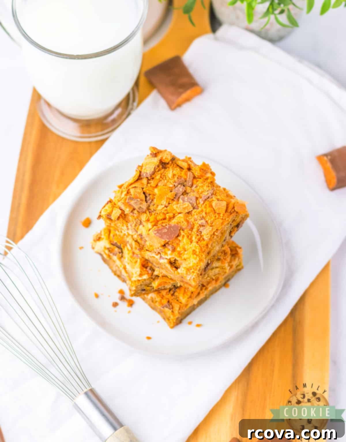 Butterfinger Crunch Cookie Bars 9 A stunning spread of Butterfinger Cookie Bars, displaying their tempting layers of blondie, peanut butter frosting, and crushed candy.
