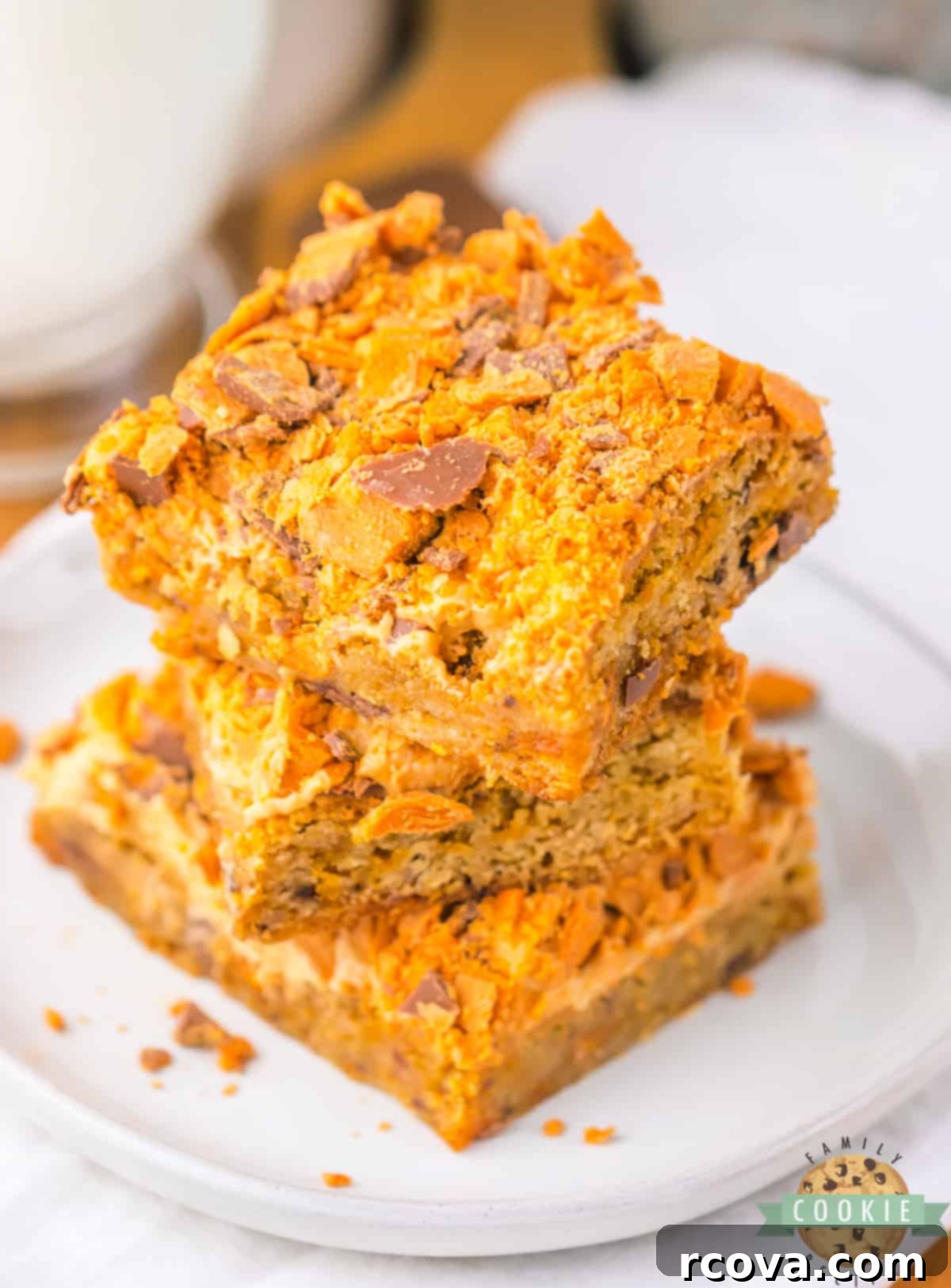 Butterfinger Crunch Cookie Bars 10 An inviting pile of Butterfinger Cookie Bars, generously studded with crushed Butterfinger candy.