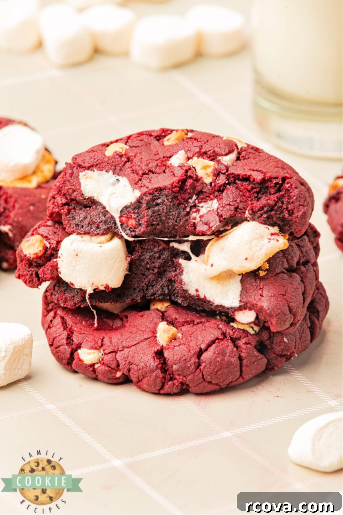 Crimson Cloud Cookies 2 Vibrant Red Velvet Marshmallow Cookies featuring gooey marshmallows and sweet white chocolate chips, baked to perfection for a soft, chewy texture.