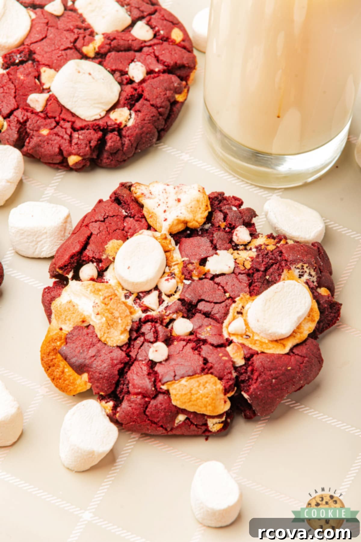 Crimson Cloud Cookies 6 A stack of freshly baked Red Velvet Marshmallow Cookies, soft, chewy, and studded with white chocolate chips and gooey marshmallows.