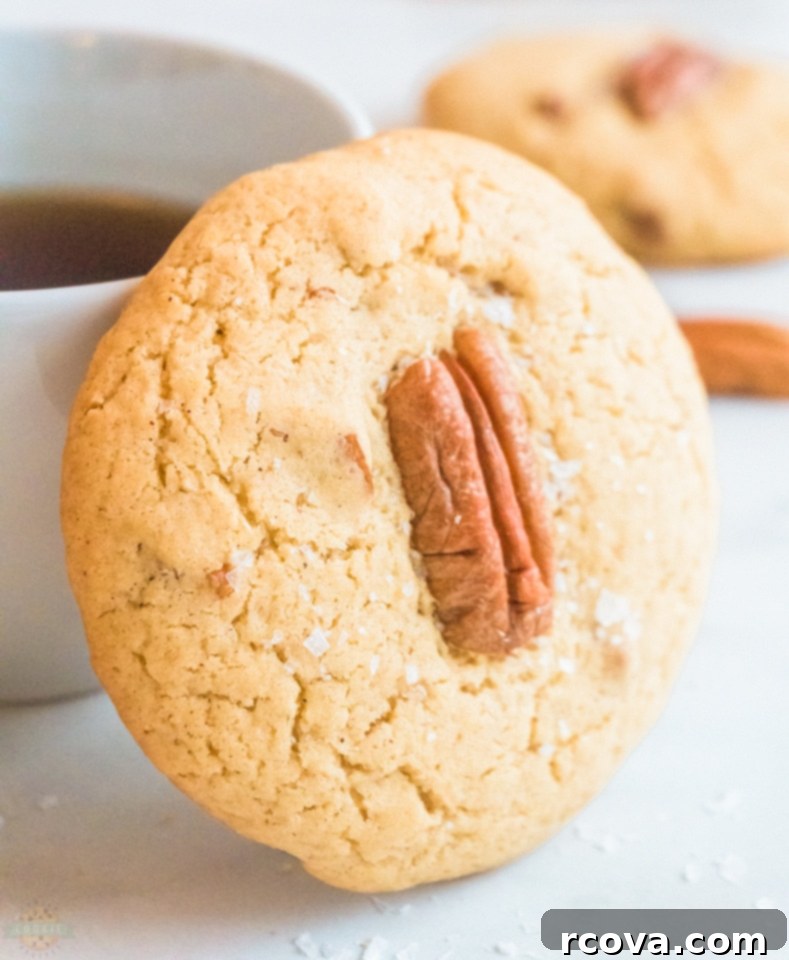Buttery Pecan Perfection 2 How to make Butter Pecan Cookie recipe - a close-up of a soft butter pecan cookie topped with a pecan half.