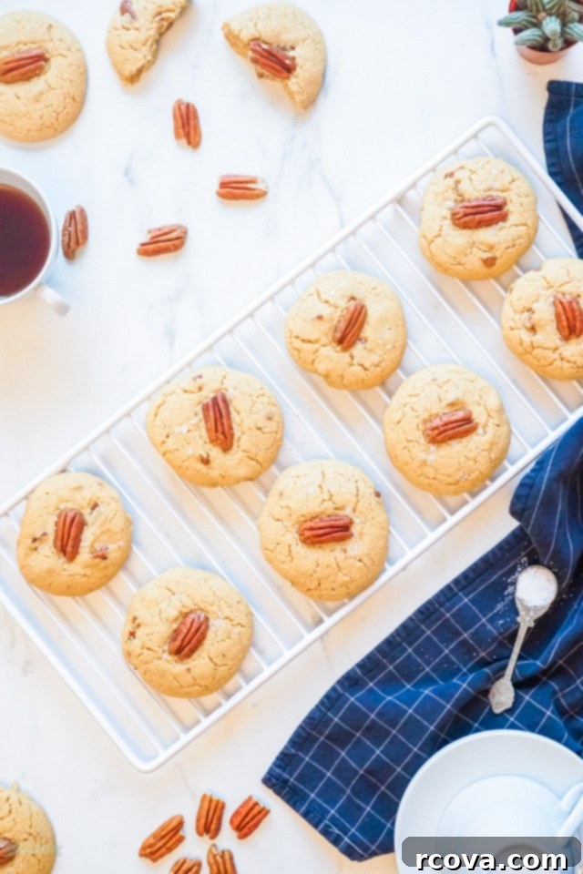 Buttery Pecan Perfection 8 Close-up of a stack of fresh Butter Pecan Cookies with a soft, chewy texture.