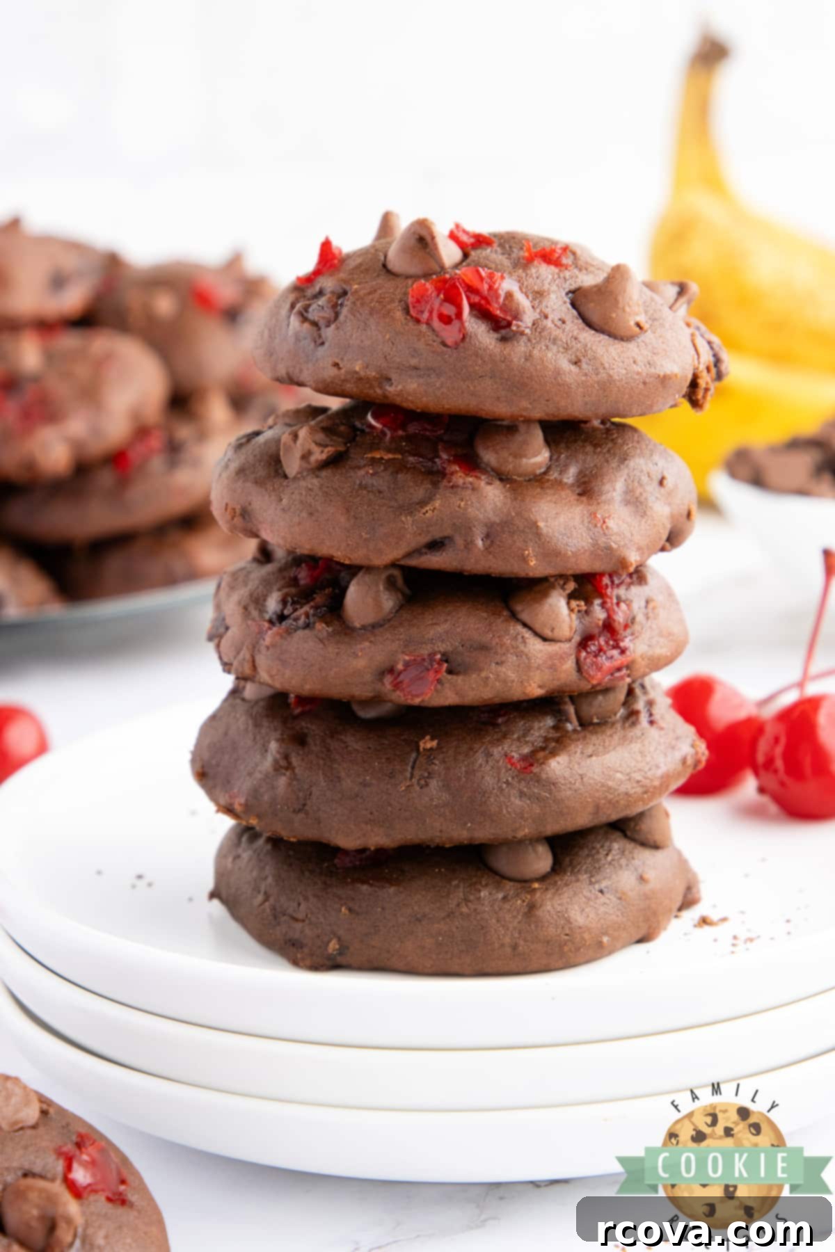 Double Chocolate Banana Split Dream Cookies 14 A stack of three Double Chocolate Banana Split Cookies on a white plate.