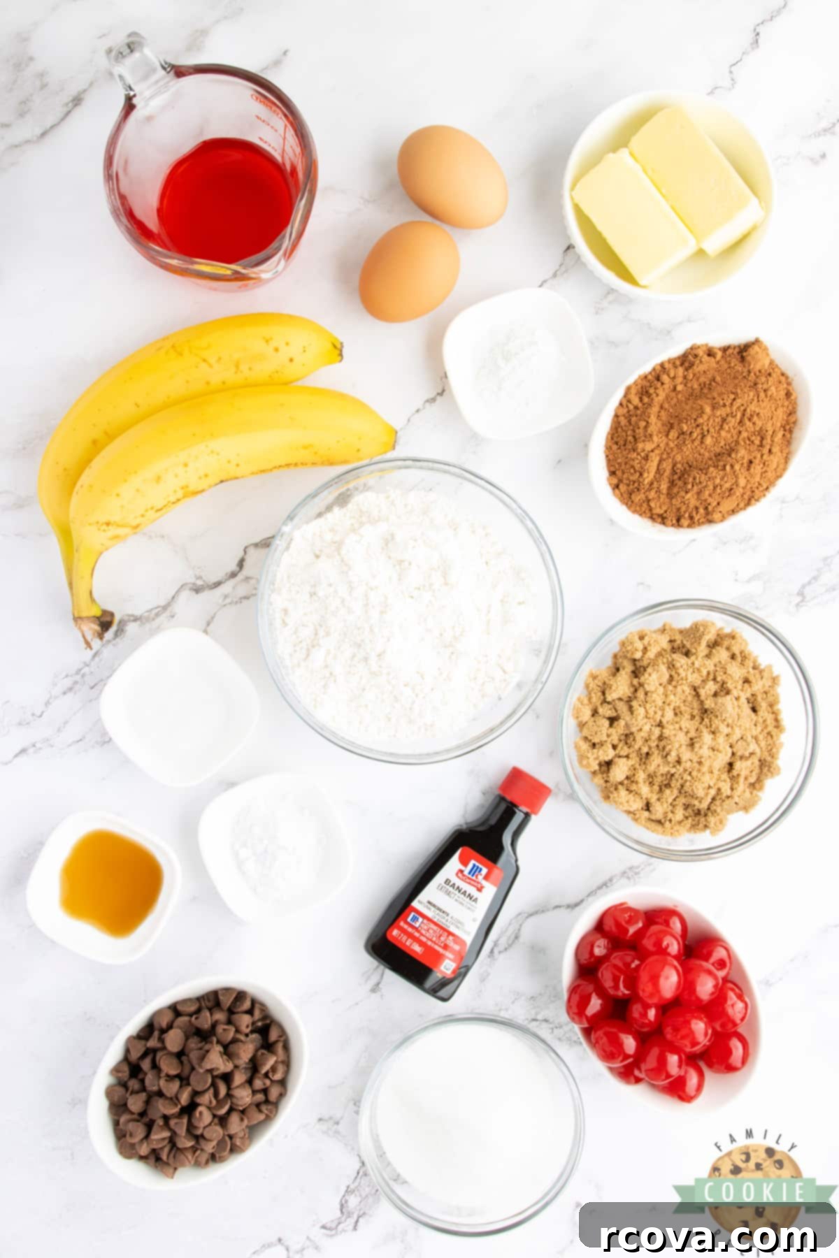 Double Chocolate Banana Split Dream Cookies 4 Assortment of ingredients for Double Chocolate Banana Split Cookies, including flour, cocoa, sugars, butter, eggs, bananas, cherries, and chocolate chips.