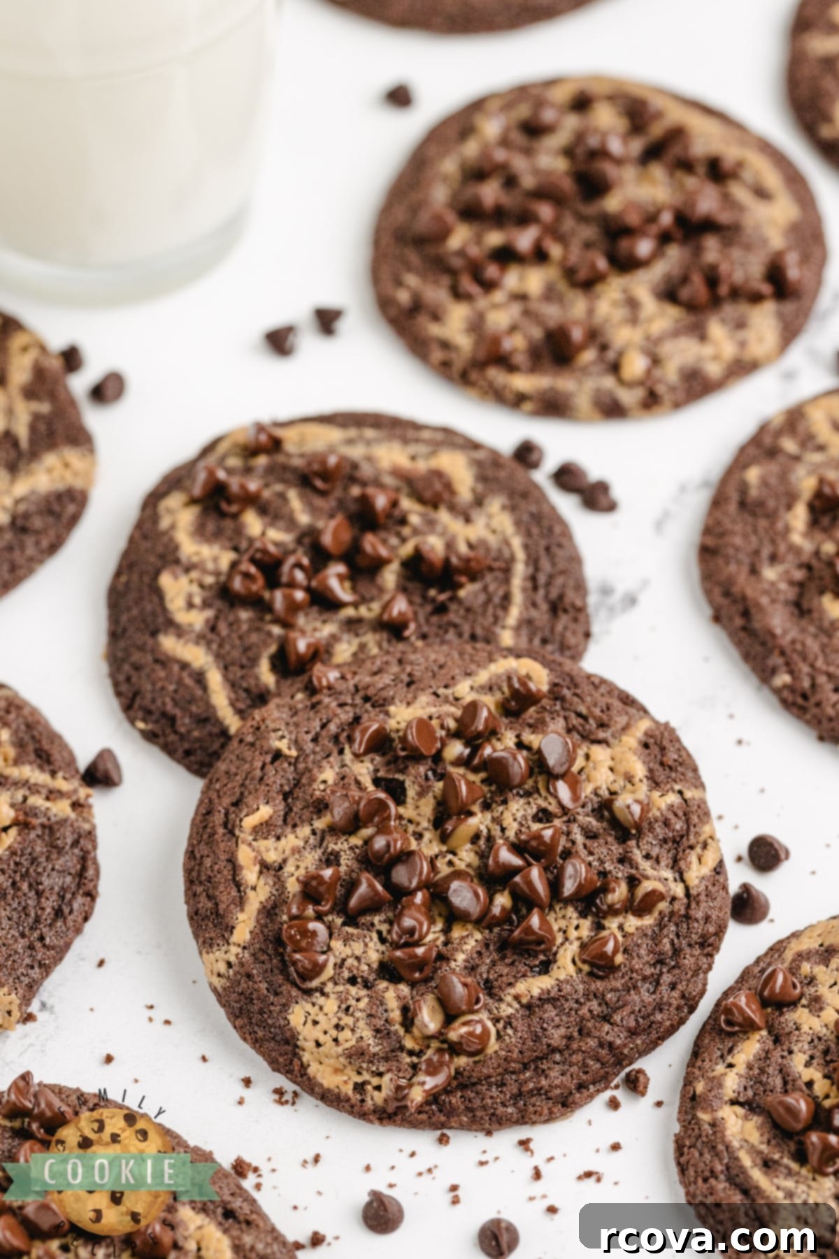 Irresistible Chocolate Peanut Butter Swirl Cookies 13 A platter of beautifully baked Chocolate Peanut Butter Swirl Cookies, showcasing their soft, chewy texture, distinct peanut butter swirls, and shiny mini chocolate chips.