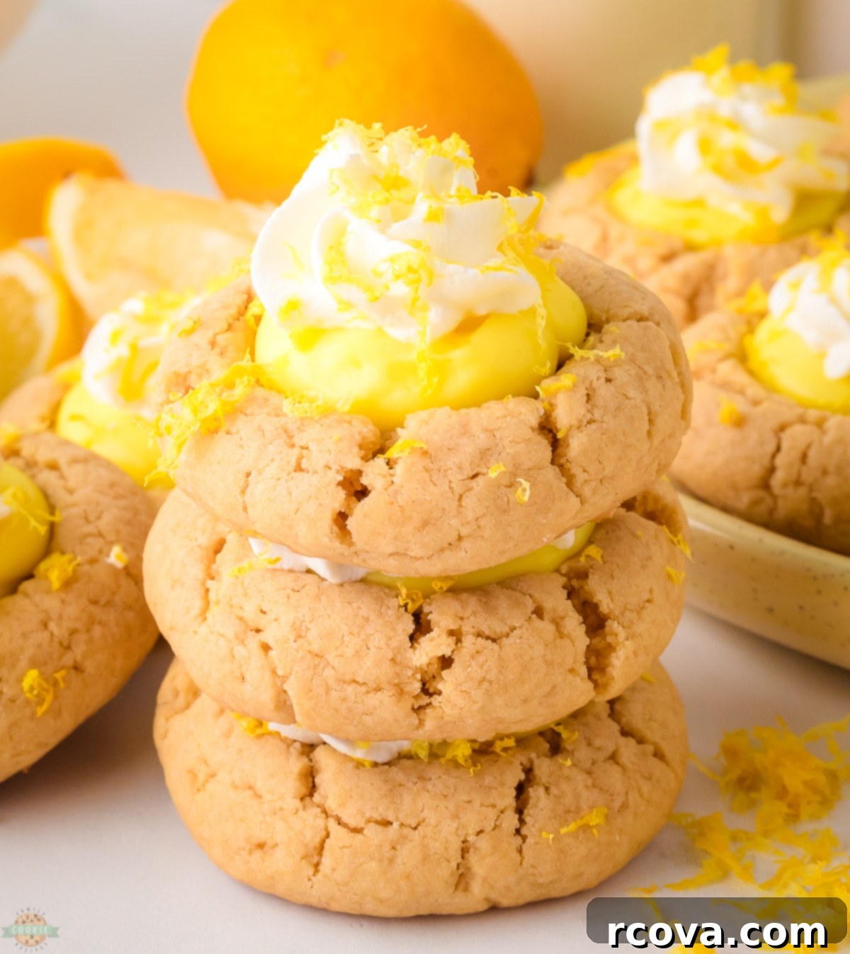 Sunshine Lemon Pie Cookies 2 stacked lemon pie cookies, showcasing layers of cookie, lemon pudding, and whipped cream
