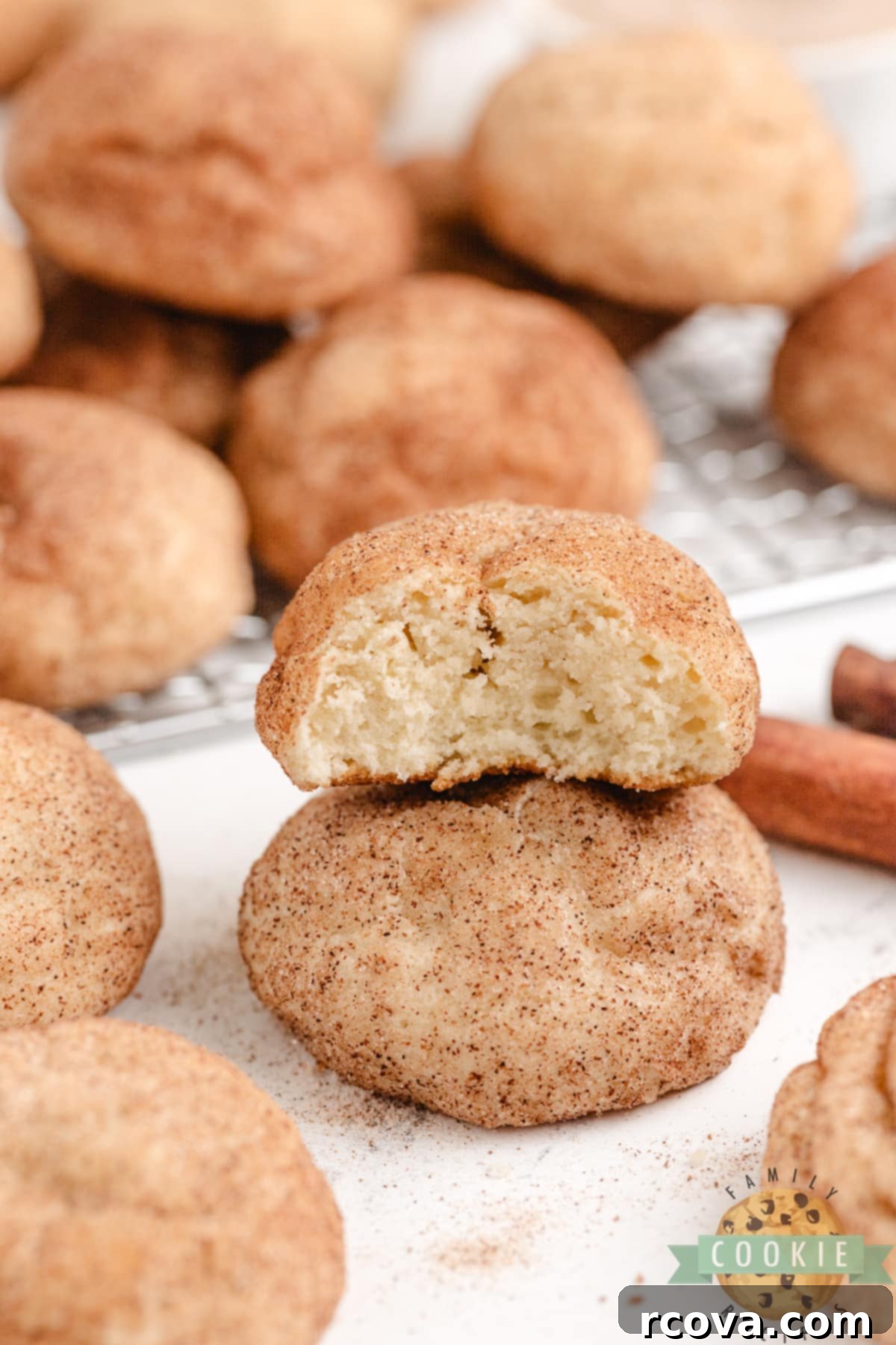 Creamy Snickerdoodle Delights 3 A stack of thick, perfectly baked cream cheese snickerdoodle cookies, showcasing their chewy texture and cinnamon-sugar coating.
