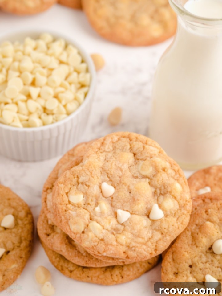 White Chocolate Macadamia Nut Indulgence 8 White Chocolate Macadamia Nut Cookies on a cooling rack