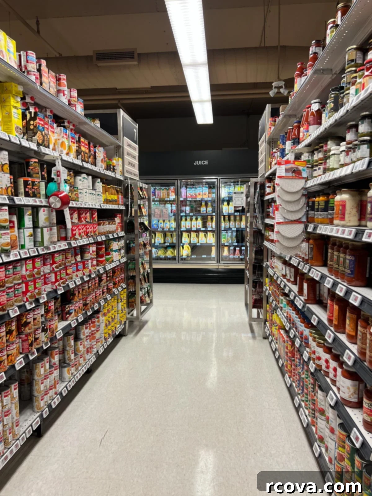 Quick Grocery Lists Made Simple 5 The canned goods aisle at the grocery store, including the juice section at the back.