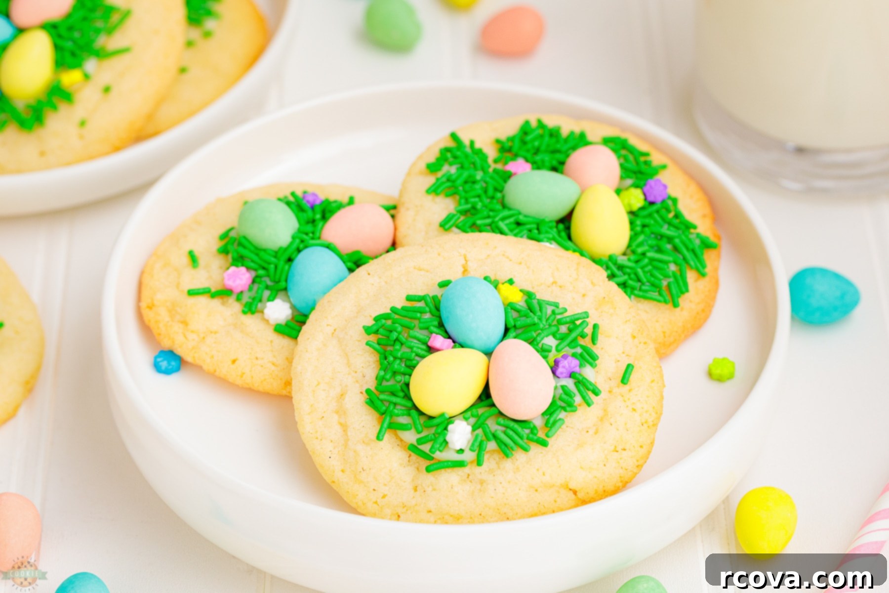 Sweet & Simple Easter Sugar Cookies 2 easy Easter Sugar cookies on a white plate, decorated like nests