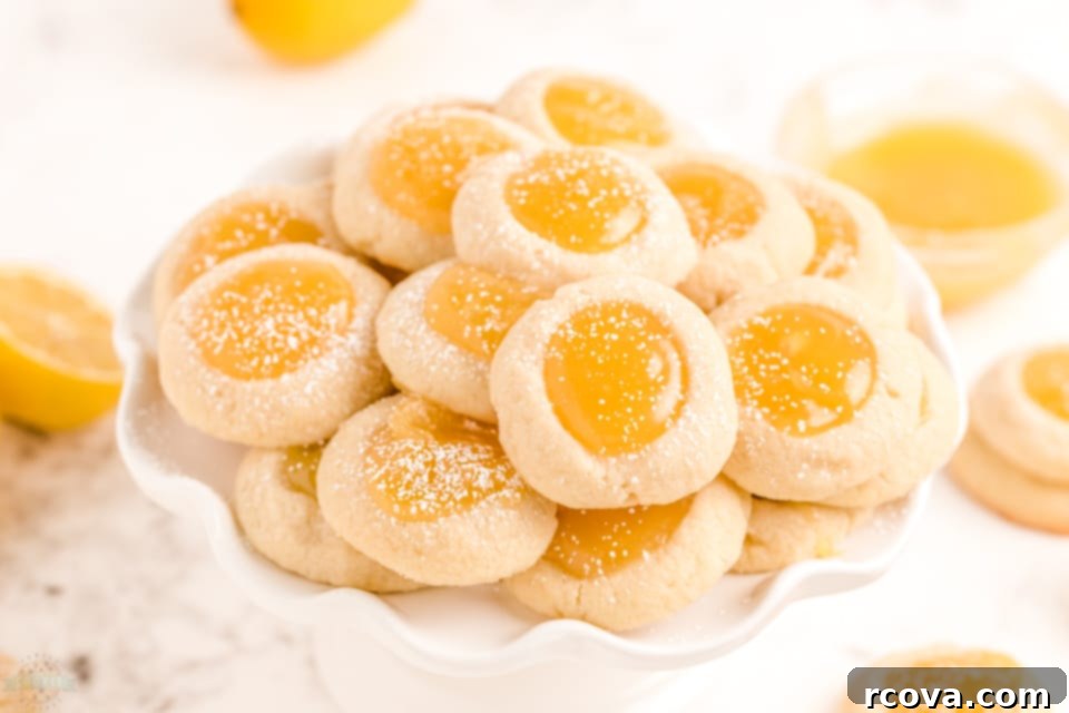 Zesty Lemon Thumbprint Delights 2 Lemon Thumbprint Cookies recipe, a buttery shortbread cookie filled with bright lemon curd.