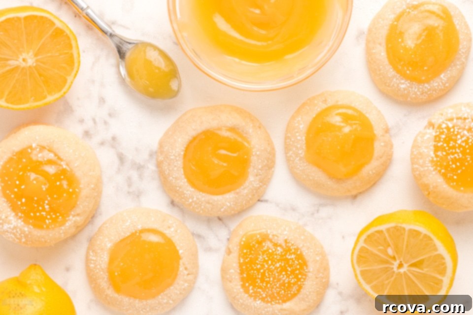 Zesty Lemon Thumbprint Delights 9 Close-up of baked Lemon Thumbprint Cookies with bright yellow curd.