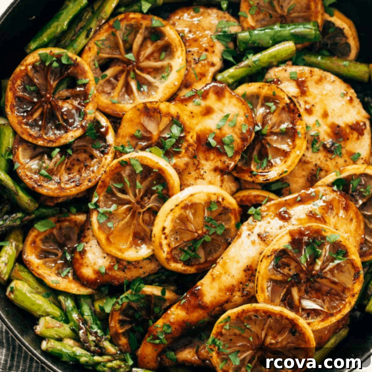 Healthy 5-Ingredient Meals for Breakfast Lunch and Dinner 26 A bright and flavorful plate of 5 Ingredient Lemon Chicken with Asparagus, garnished with fresh herbs and a vibrant lemon slice, ready to be enjoyed.