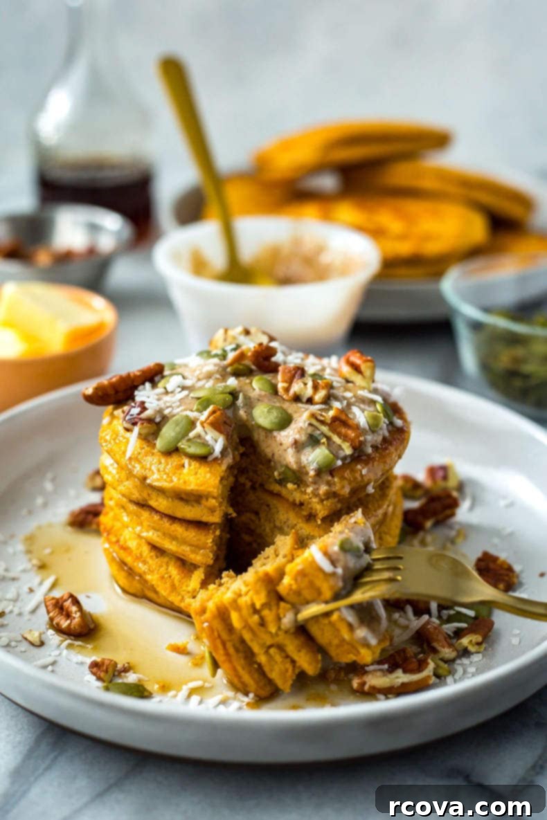 Healthy 5-Ingredient Meals for Breakfast Lunch and Dinner 6 A tempting stack of golden brown 5-Ingredient Pumpkin Protein Pancakes, garnished with a sprinkle of cinnamon, ready for a cozy breakfast.