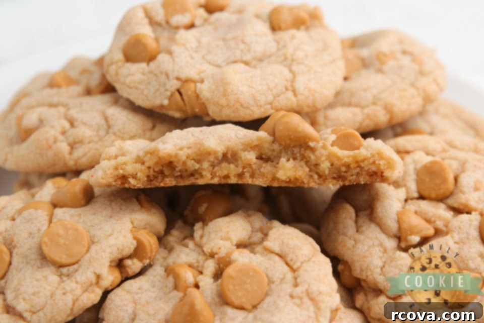 Effortless Butterscotch Delights 7 A close-up of a stack of freshly baked Easy Butterscotch Cookies on a wire rack, with some individual cookies scattered around, highlighting their perfect texture.