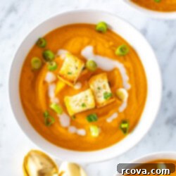 Velvety Vegan Coconut Carrot Ginger Soup 9 A bowl of creamy coconut carrot soup.