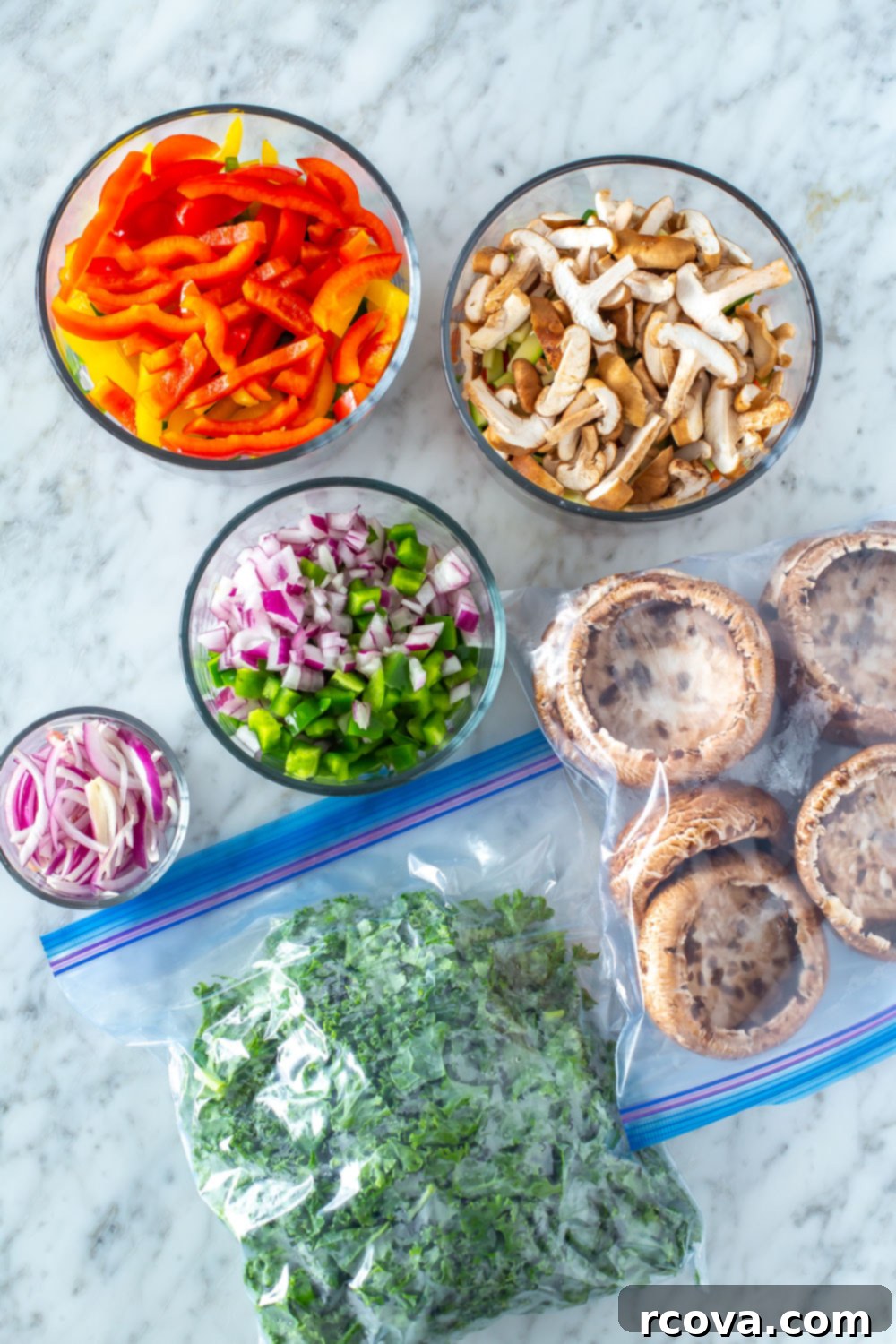 Solo Meal Prep: Recipes for One 5 Organized glass containers filled with various prepped ingredients like chopped vegetables, cooked proteins, and grains