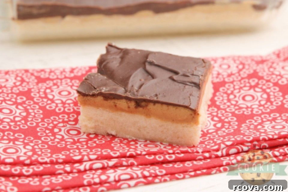 Ultimate Tagalong Cookie Bars 2 Delicious Homemade Tagalong Cookie Bars with a thick shortbread crust, creamy peanut butter, and rich chocolate topping, perfect for any occasion.