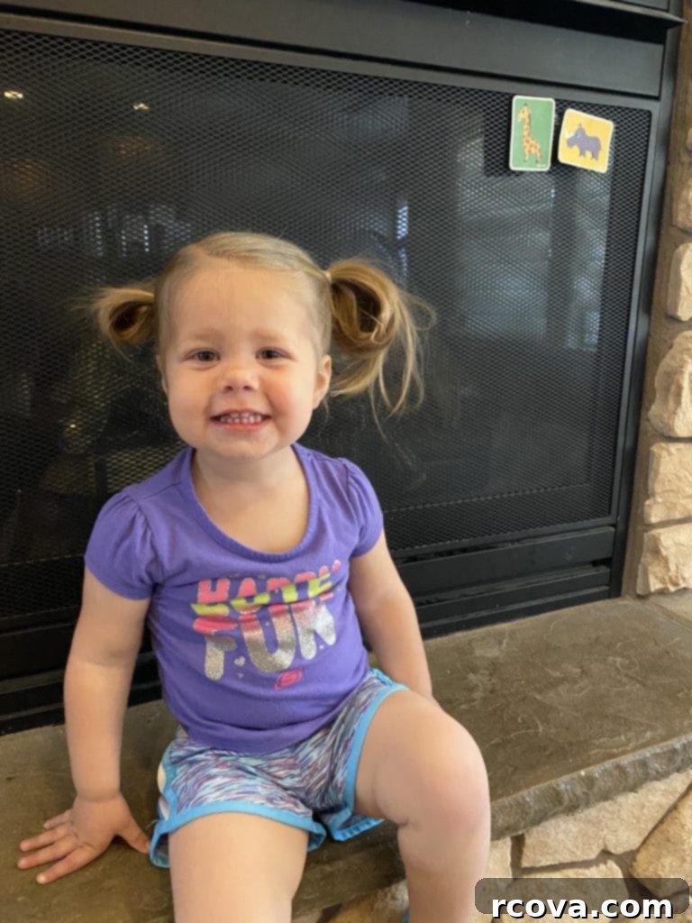 Ultimate Tagalong Cookie Bars 11 A young girl with messy pigtails enjoying the outdoors, symbolizing family fun and simple joys.
