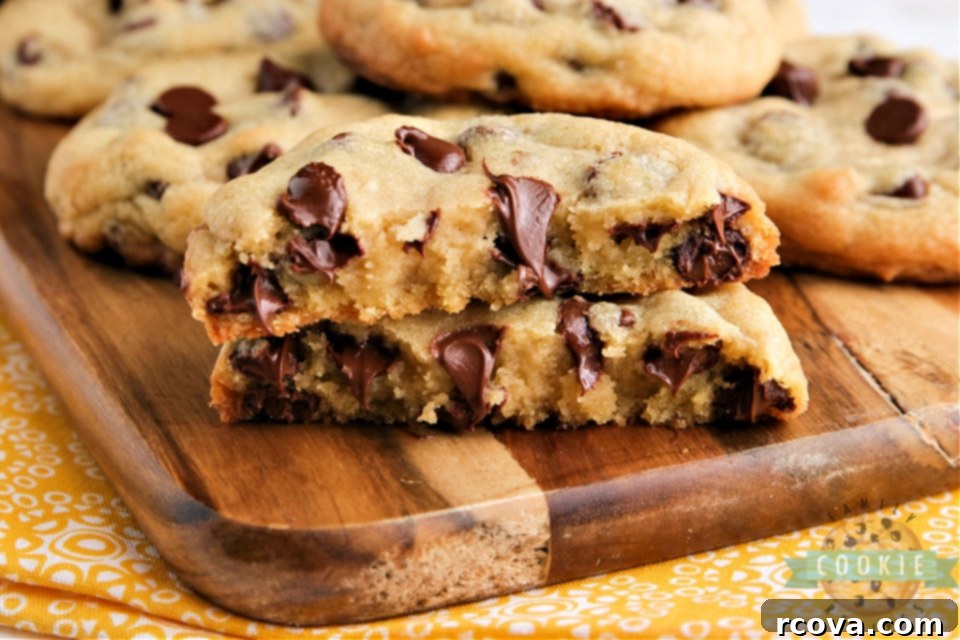 Ultimate Bakery Chocolate Chip Cookies 9 Close-up of a warm, gooey chocolate chip cookie with melting chocolate