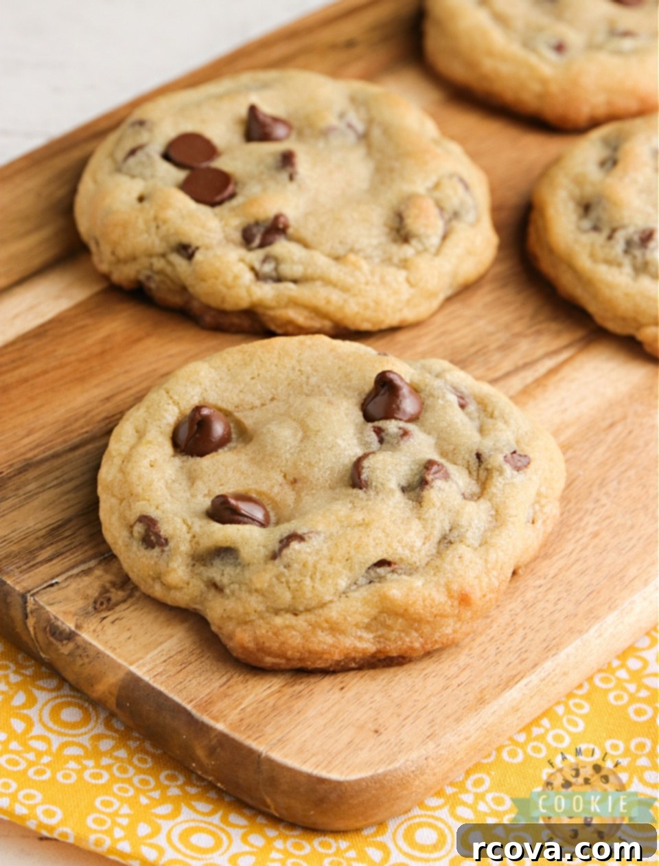 Ultimate Bakery Chocolate Chip Cookies 10 A stack of golden-brown Bakery Style Chocolate Chip Cookies