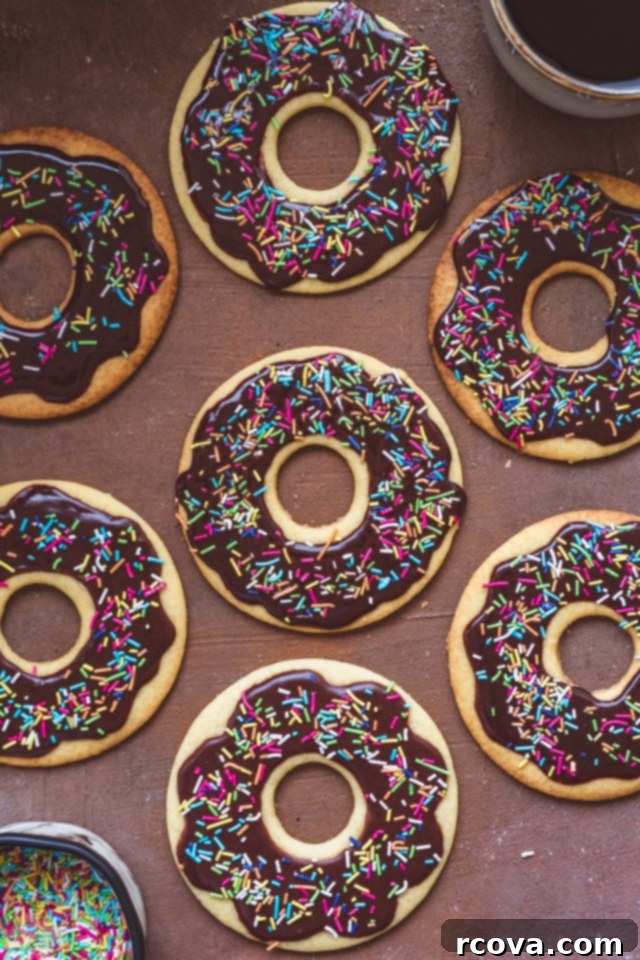 Donut Shop Chocolate Glazed Cookies 3 Close-up of a stack of Chocolate Glazed Donut Cookies, showcasing the texture and sprinkles