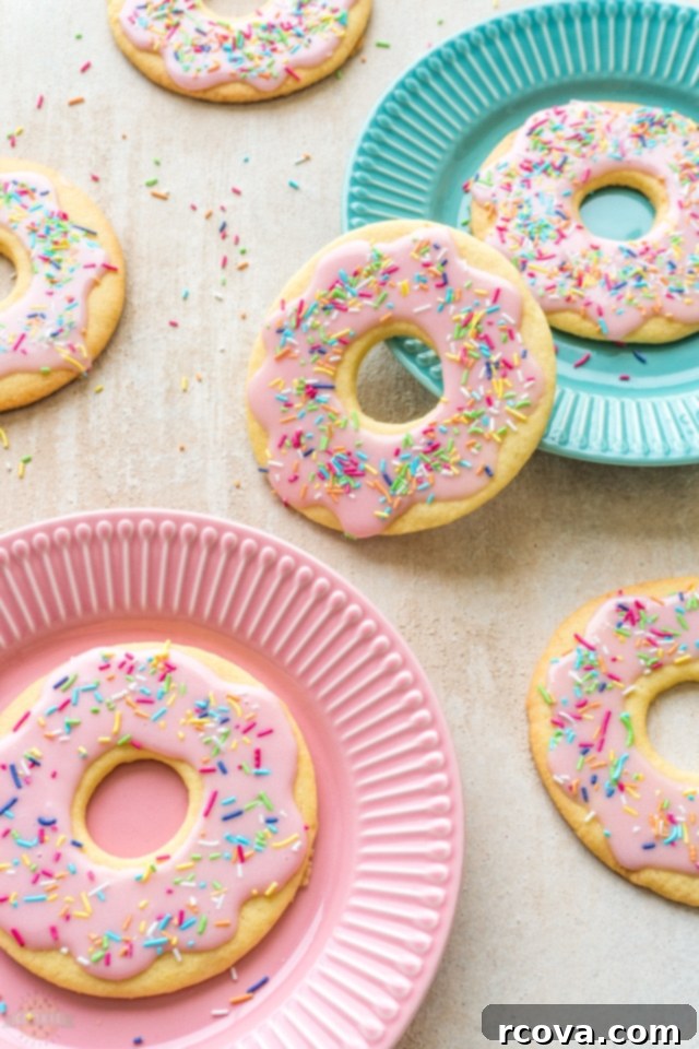 Rosy Donut Delights 7 Pink Donut Cookies with colorful sprinkles arranged beautifully on a serving plate.