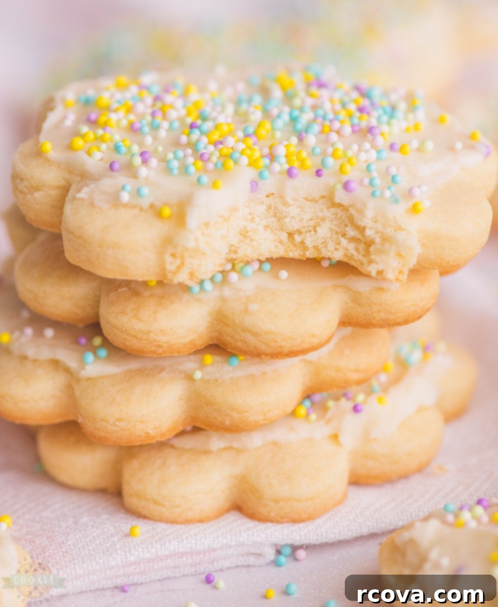 Classic Butter Sugar Cookies 2 Freshly baked all-butter sugar cookies topped with creamy vanilla frosting and colorful sprinkles.
