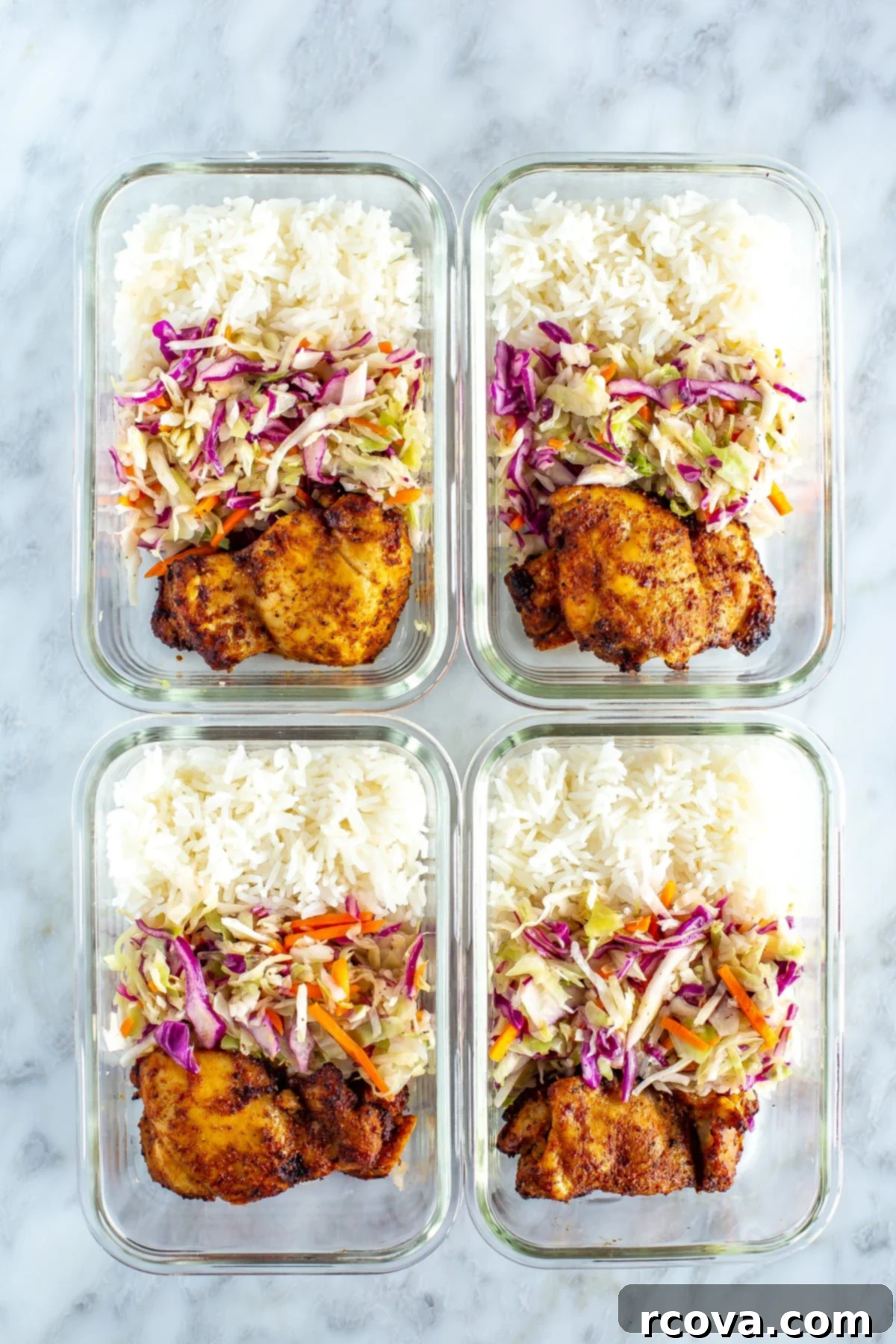 Versatile Air Fryer Chicken Thighs Bone In Or Boneless 8 Prepped air fryer chicken thighs, rice, and coleslaw neatly packed into individual glass meal prep bowls, showcasing a healthy and convenient ready-to-eat meal solution.