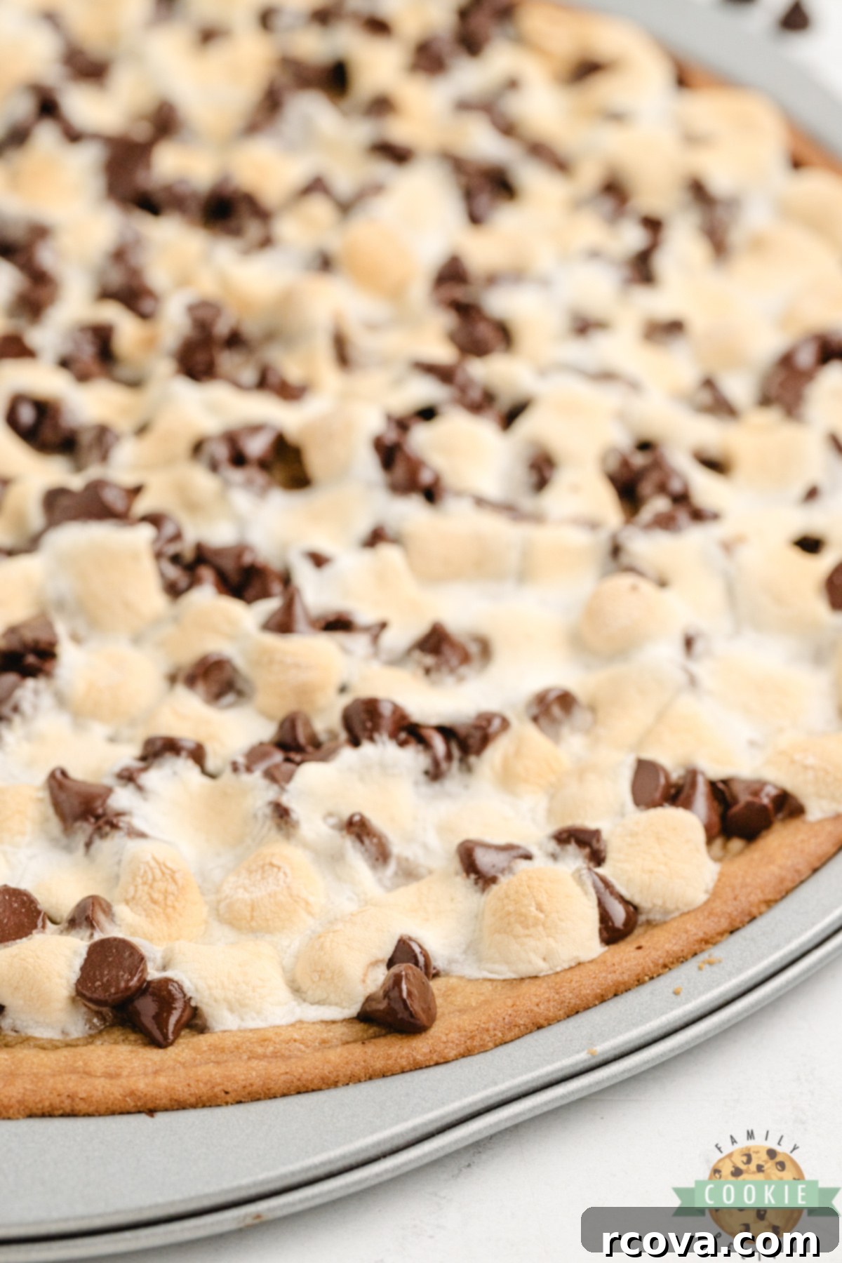 Giant Peanut Butter Cookie Pie 3 Peanut Butter Cookie Pizza is chewy, gooey, and loaded with marshmallows and chocolate. A fast, fun dessert everyone will love!